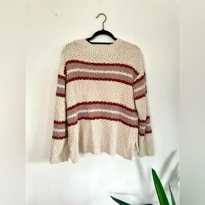 Cream sweater w/ neutral red & purple stripes, size M.